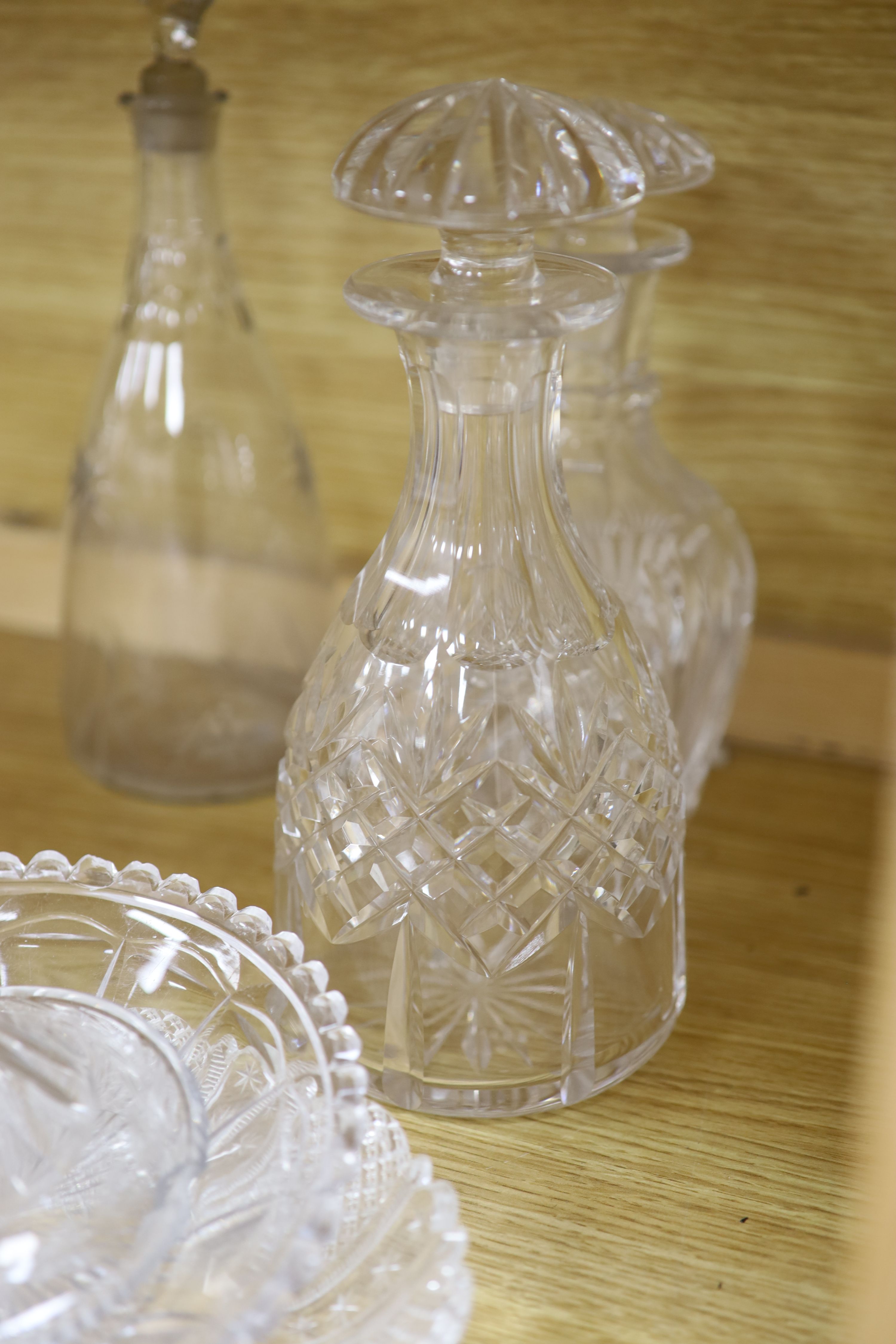 A pair of cut glass decanters, two others and mixed cut glass